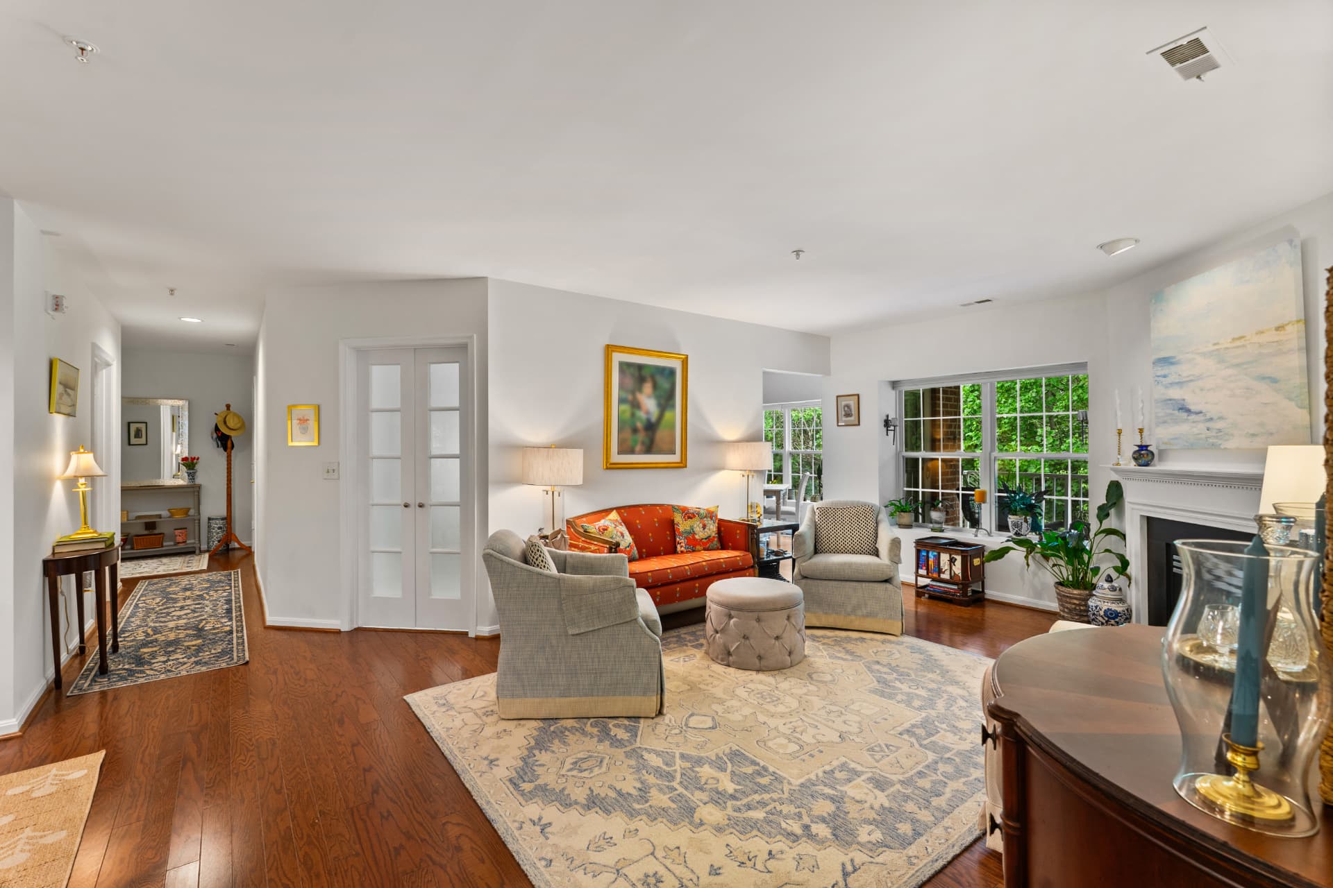 508 Limerick Circle Unit 303 — open living room with hardwood floors, fireplace and bay window seating